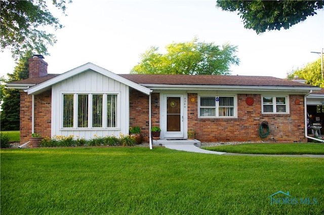 ranch-style house with a front lawn, brick siding, and a chimney