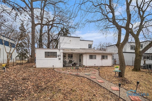 view of front of property with a patio and fence