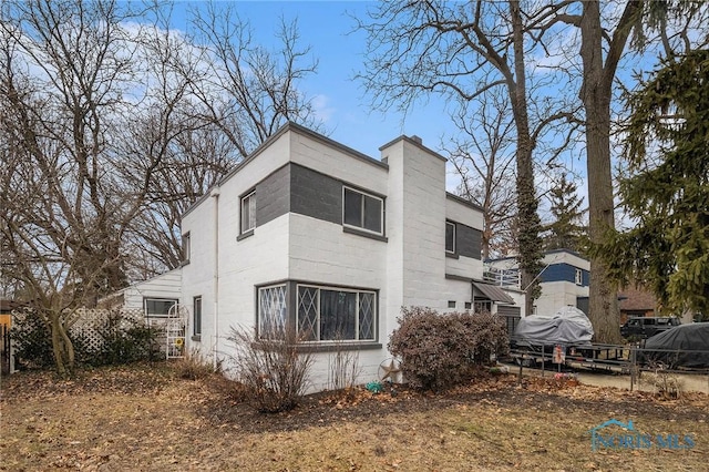 view of home's exterior featuring a chimney