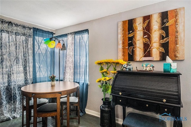 dining area featuring baseboards