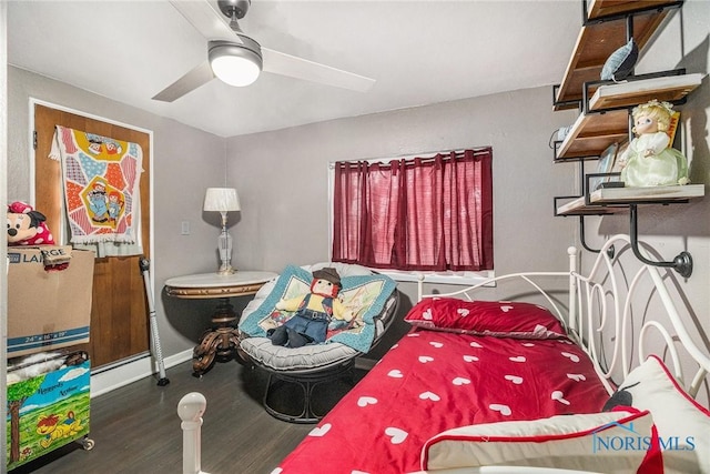 bedroom with baseboards, wood finished floors, and a ceiling fan