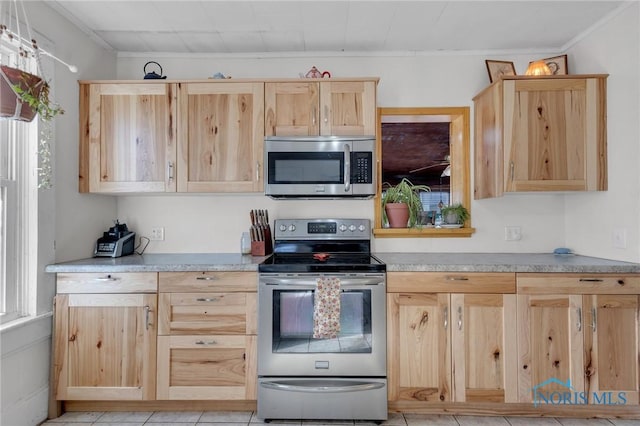 10243 S Dixie Hwy, Portage, OH 43451 - kitchen with light countertops, light brown cabinets, appliances with stainless steel finishes, and crown molding