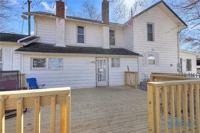 10243 S Dixie Hwy, Portage, OH 43451 - rear view of house featuring a deck and a chimney