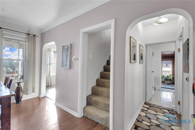 10243 S Dixie Hwy, Portage, OH 43451 - entryway with arched walkways, baseboards, stairway, and wood finished floors