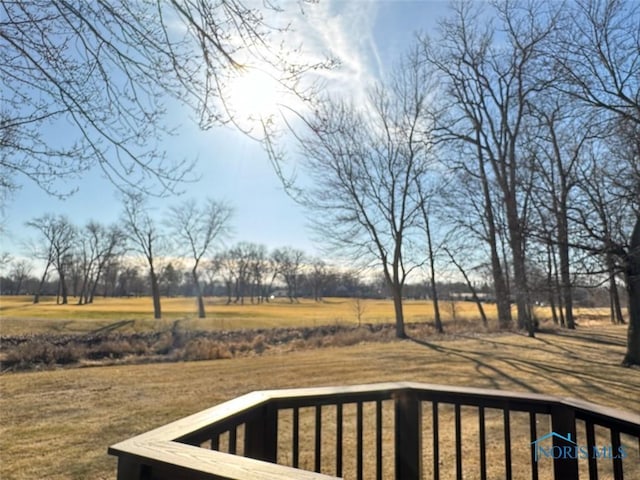 wooden deck featuring a rural view