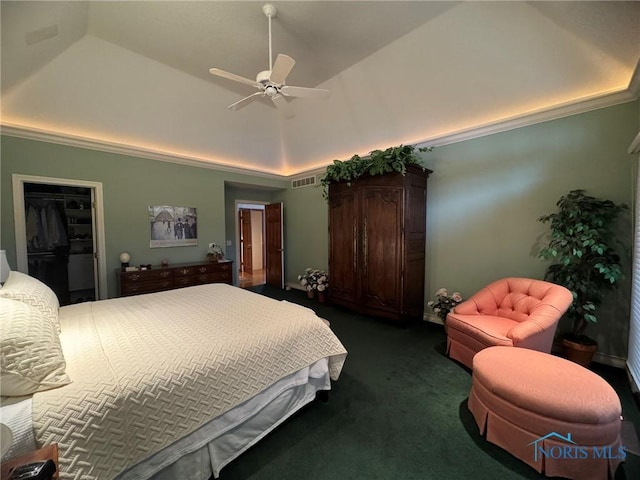 bedroom featuring visible vents, lofted ceiling, a closet, a raised ceiling, and dark colored carpet