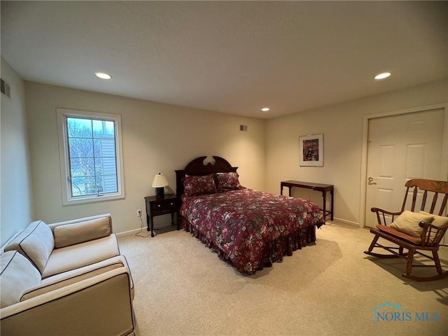 bedroom with light carpet, visible vents, and recessed lighting