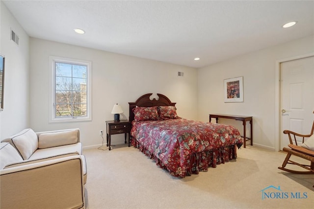 bedroom featuring recessed lighting, visible vents, light carpet, and baseboards