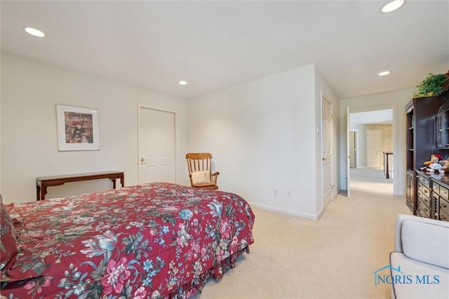 carpeted bedroom featuring recessed lighting and baseboards