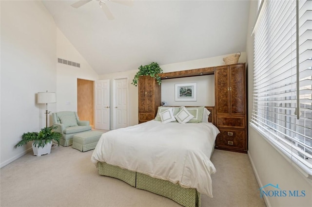 carpeted bedroom featuring visible vents, baseboards, high vaulted ceiling, and ceiling fan