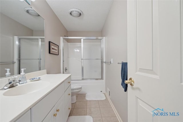 bathroom featuring visible vents, baseboards, toilet, tile patterned floors, and vanity