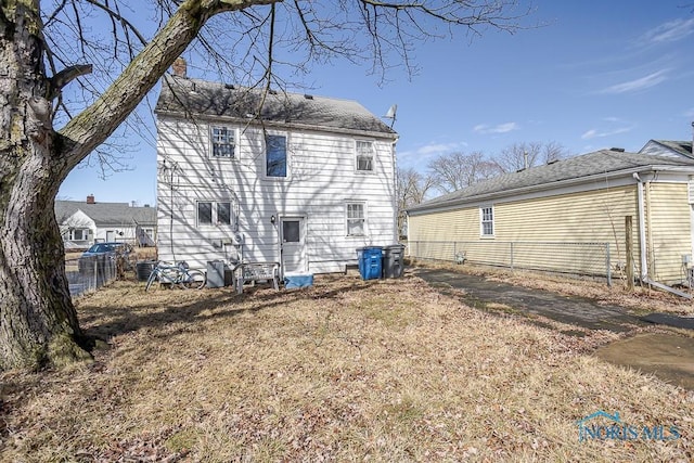 back of property with fence