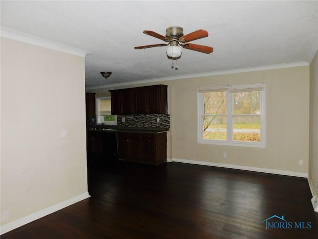 kitchen with decorative backsplash, ornamental molding, and dark wood-style flooring