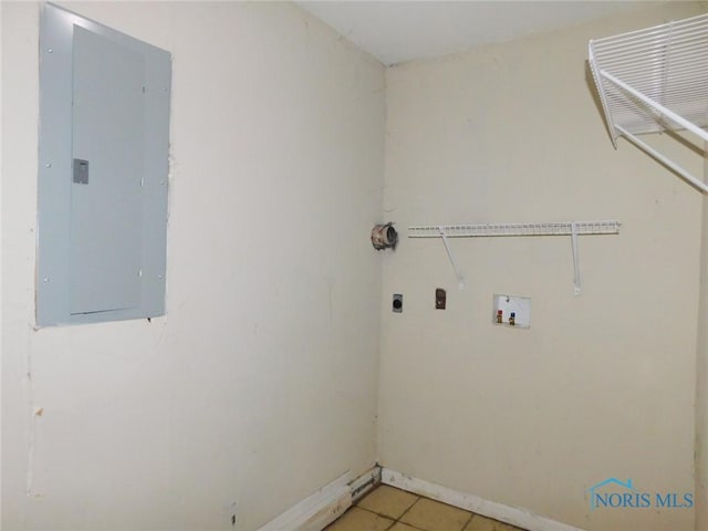 clothes washing area with washer hookup, electric panel, laundry area, light tile patterned flooring, and hookup for an electric dryer