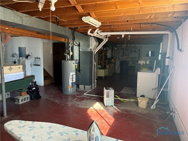 unfinished below grade area with stairs, heating unit, washer / dryer, and water heater