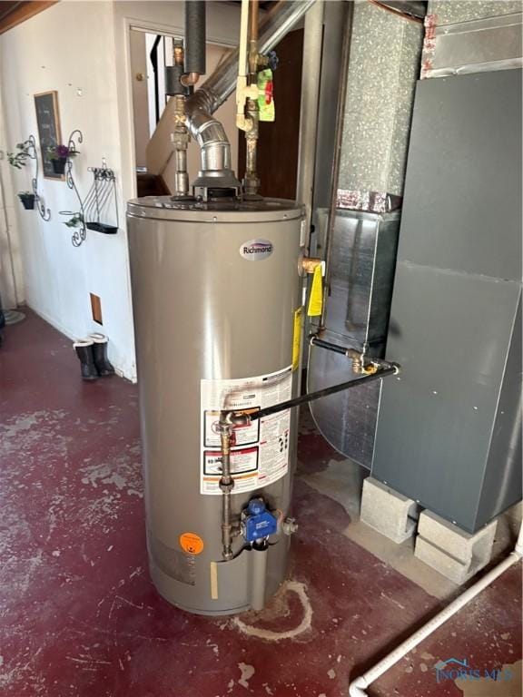 utility room featuring gas water heater and heating unit