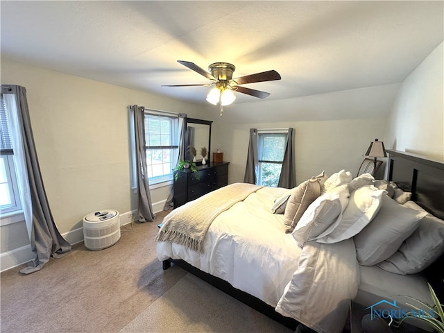 carpeted bedroom featuring ceiling fan and baseboards