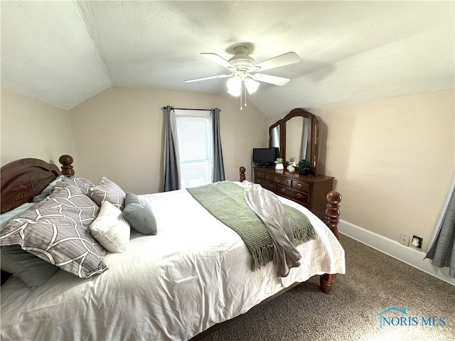 bedroom featuring vaulted ceiling, carpet flooring, baseboards, and a textured ceiling