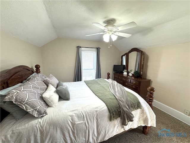 carpeted bedroom featuring lofted ceiling, a ceiling fan, baseboards, and a textured ceiling