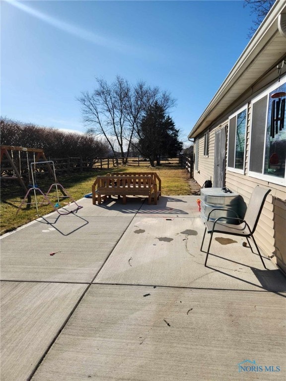 view of patio / terrace featuring fence