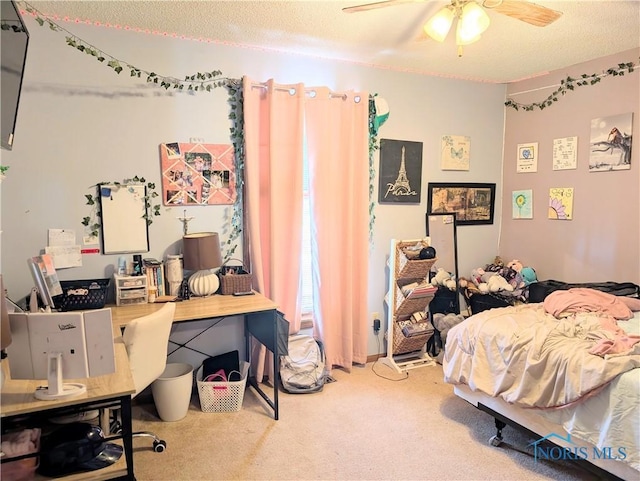 bedroom with carpet floors, a textured ceiling, and ceiling fan