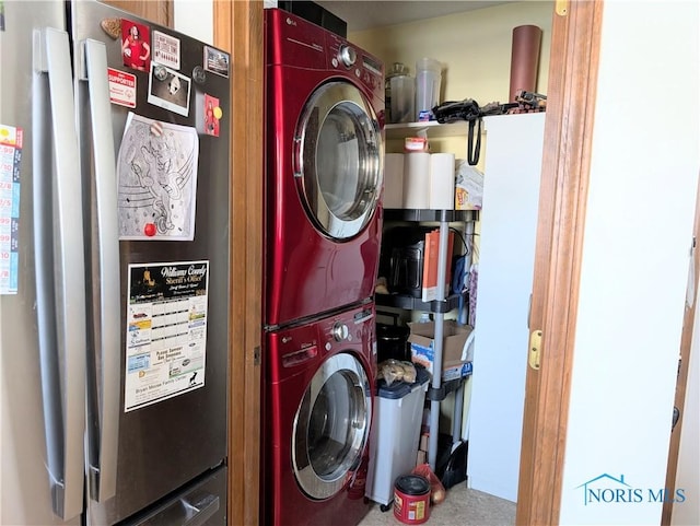 laundry room featuring laundry area and stacked washer / dryer