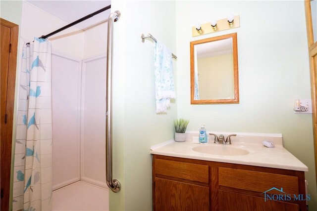 full bathroom with vanity and a shower with shower curtain