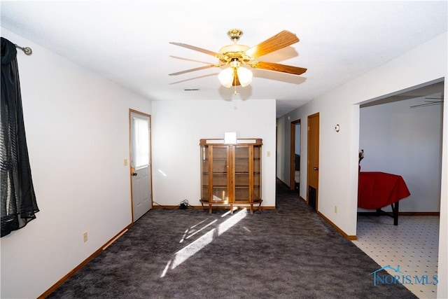unfurnished bedroom featuring visible vents, ceiling fan, baseboards, and carpet
