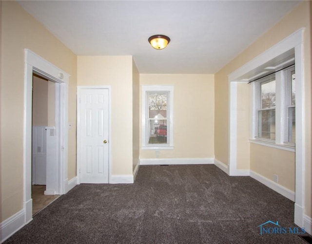 unfurnished bedroom with baseboards and carpet floors