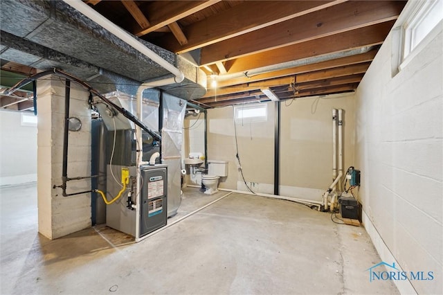 basement featuring heating unit