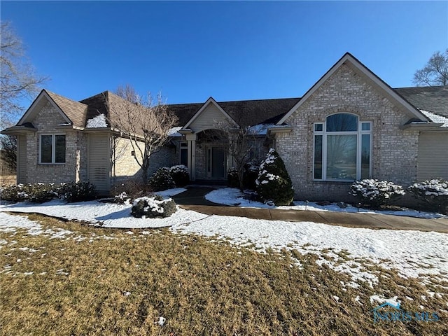 view of front of home with brick siding