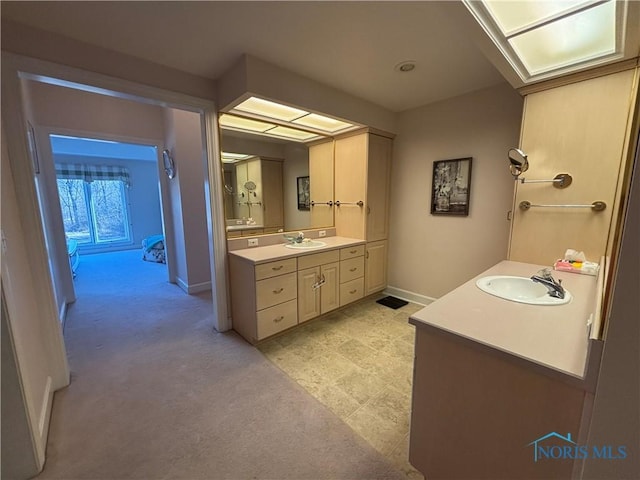 full bathroom featuring vanity and baseboards