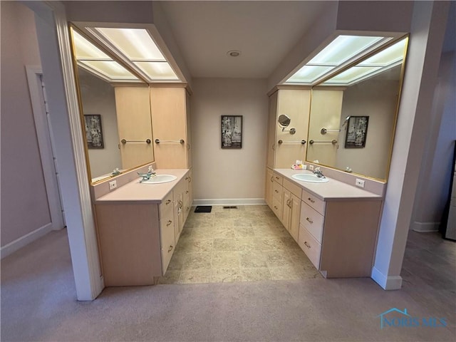 full bath with vanity, baseboards, and carpet floors