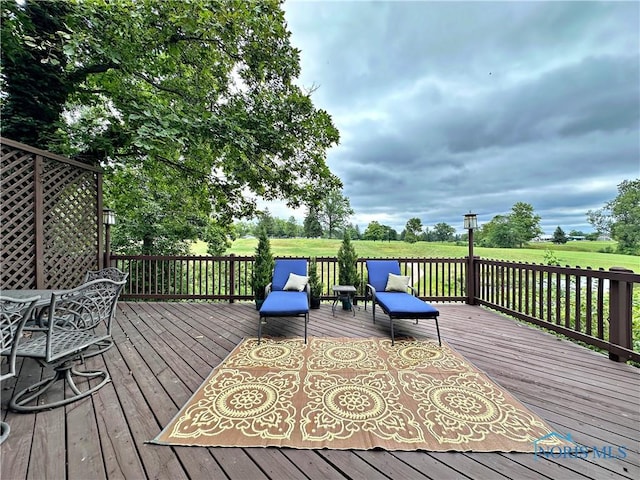 wooden deck with outdoor dining space