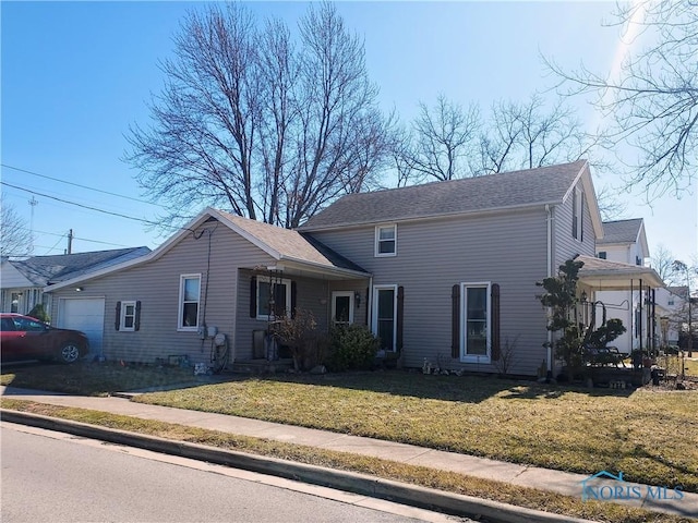 traditional-style home with a front lawn and an attached garage