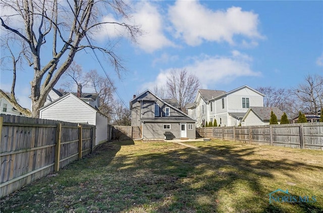 view of yard with a residential view and a fenced backyard