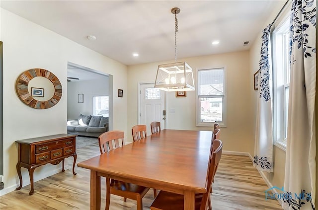 dining space featuring light wood-style flooring, recessed lighting, and baseboards