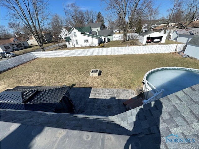 view of yard with a residential view and fence