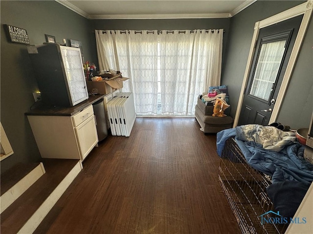 interior space featuring dark countertops, radiator heating unit, dark wood-type flooring, crown molding, and open floor plan