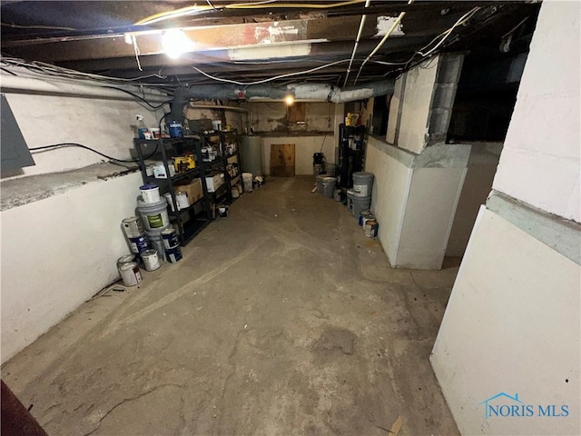 unfinished basement with water heater