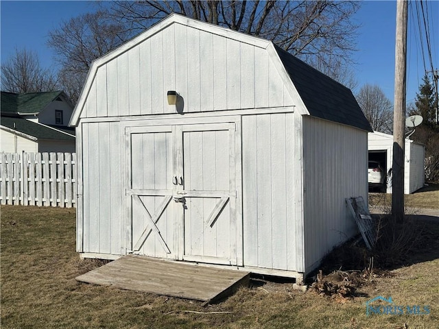 view of shed with fence