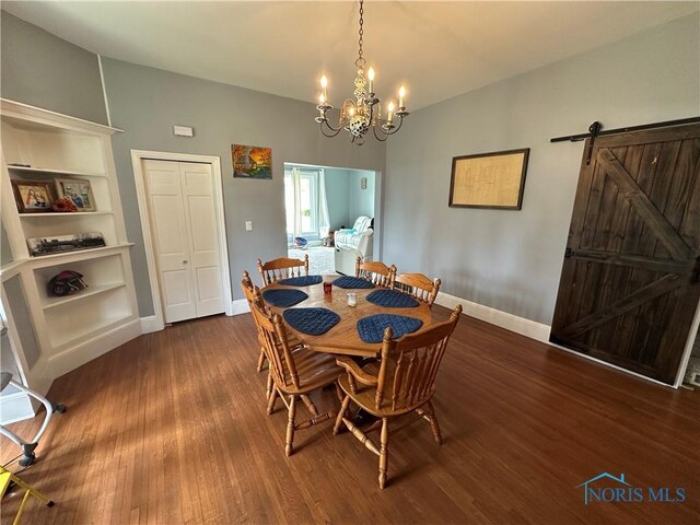 303 N Squire St, Holgate, OH 43527 - dining area with baseboards, dark wood-type flooring, a chandelier, and a barn door