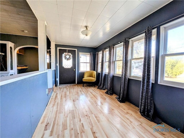 foyer featuring wood finished floors