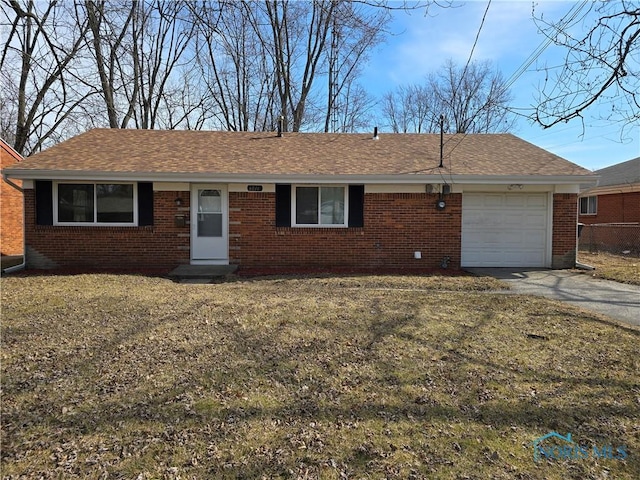 single story home with brick siding, concrete driveway, a garage, and roof with shingles