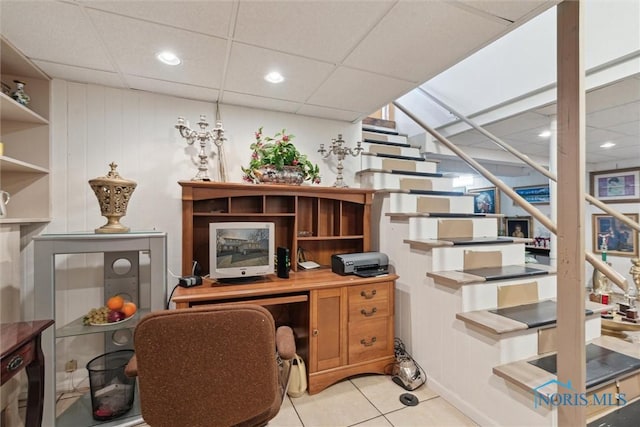 office space featuring light tile patterned floors and a paneled ceiling