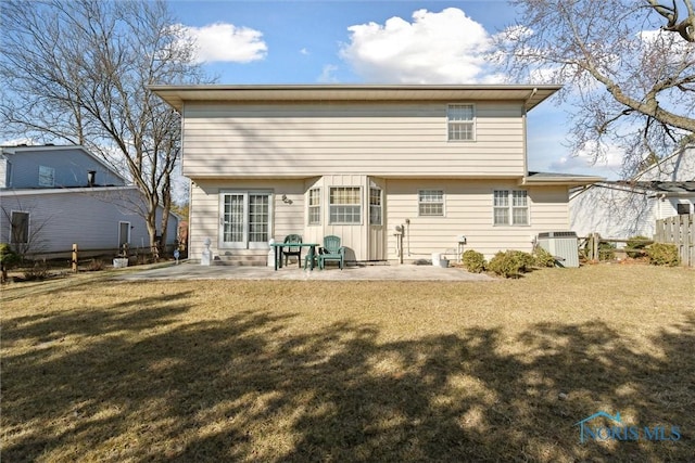 rear view of house with a patio area, central air condition unit, a yard, and fence