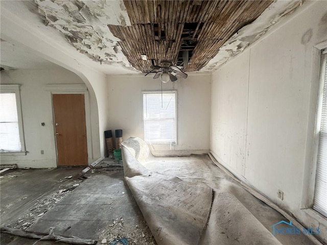 unfurnished dining area with a wealth of natural light and arched walkways