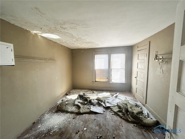 empty room with wood finished floors