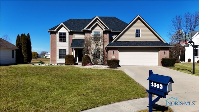 traditional home featuring brick siding, concrete driveway, and a front yard