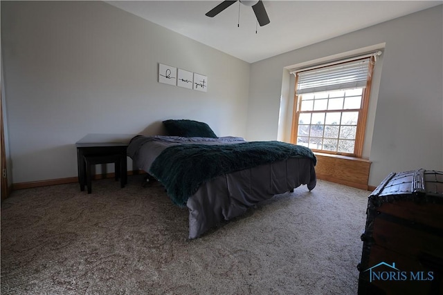 carpeted bedroom with baseboards and ceiling fan